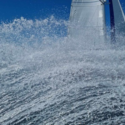 Shearwater II behind a wave
