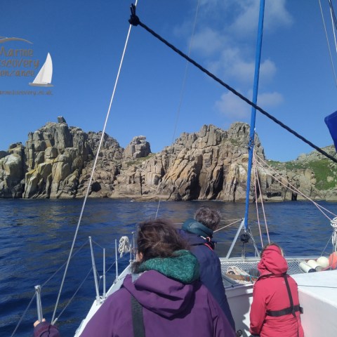 Passengers looking at cliffs