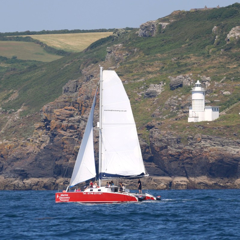 Shearwater II, sailing catamaran by coast